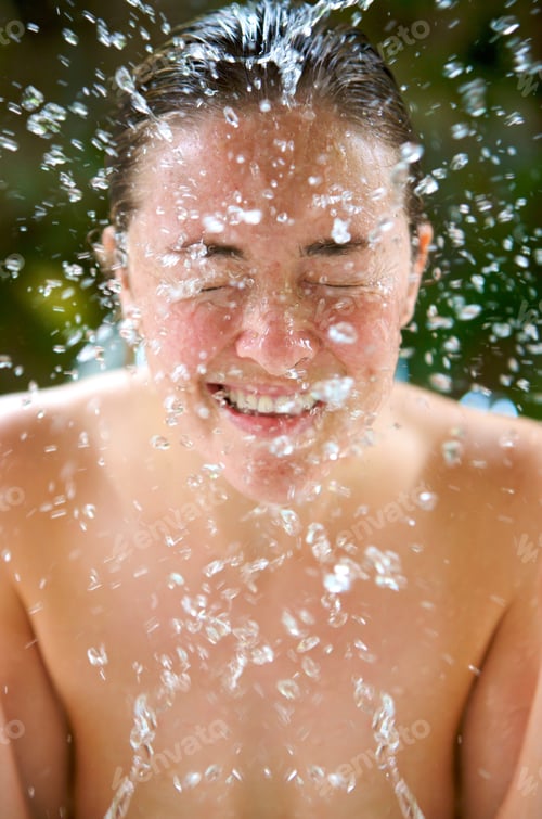 Preview: Beautiful Woman Refreshing Her Face With A Pure Water Splash