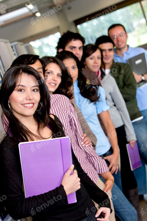 Preview: Group Of Happy Students Carrying Notebooks Indoors