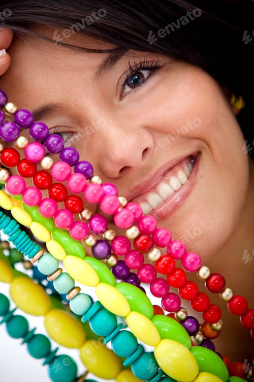 Preview: Girl With Colorful Jewelry Isolated Over A White Background