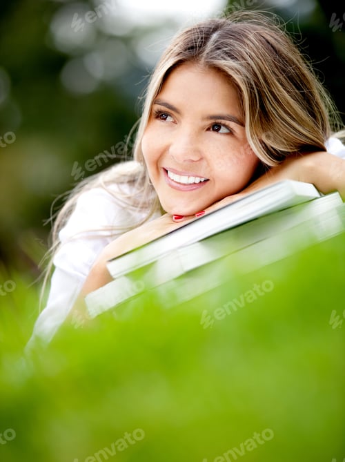 Preview: Smiling Woman Leaning on Books Outside