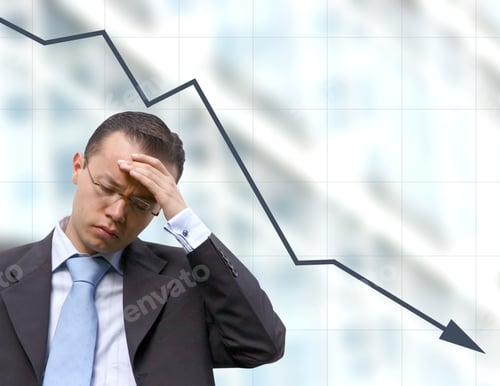 Preview: Business Man Preocupied Over A Graph Background