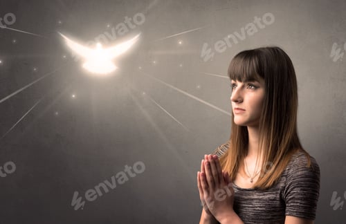 Preview: Young Woman Praying On A Grey Background With A Sparkling Bird Above Her