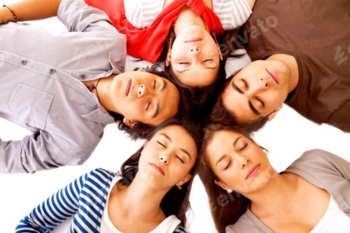 Preview: Group Of Friends Smiling With Their Heads Together On The Floor - Isolated