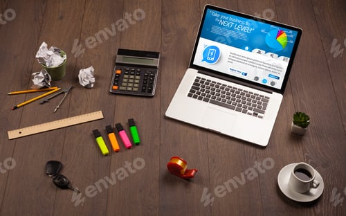Preview: Laptop On Office Wooden Desk With Business Website On Screen