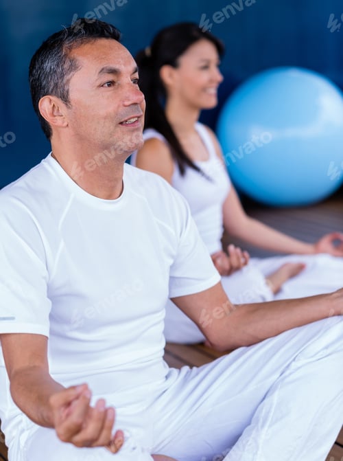 Preview: Couple Practicing Yoga And Looking Very Relaxed