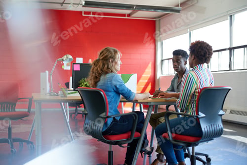 Preview: Unposed Group Of Creative Business People In An Open Concept Office Brainstorming Their Next