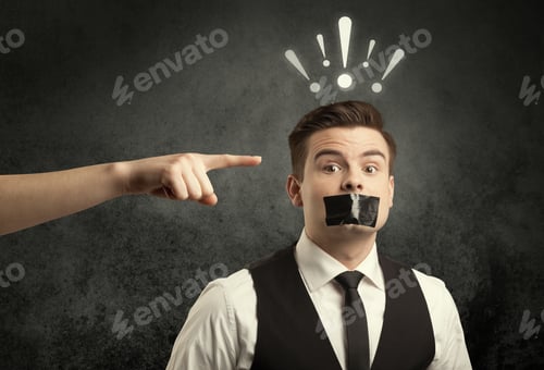 Preview: Caucasian Hand Pointing At Employee In Business Suit, With Drawn Exclamation Marks Above His Head