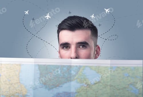 Preview: Handsome Young Man Holding A Map With Little Planes And Their Paths Above Him