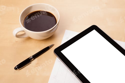 Preview: Tablet Pc With Copy Space And A Cup Of Coffee On A Wooden Work Table Close-Up