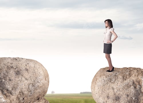 Preview: Young Businesswoman Standing On Edge Of Rock Mountain