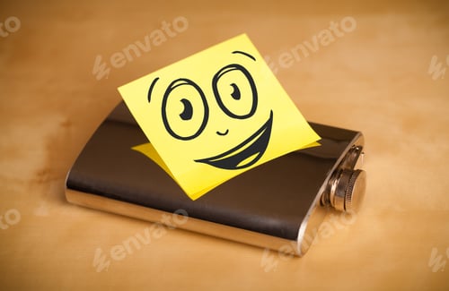 Preview: Drawn Smiley Face On A Post-It Note Sticked On A Hip Flask
