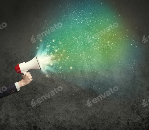 Preview: Caucasian Business Hand Holding Megaphone With White Sparkles On A Grunge Background