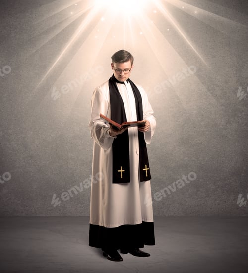 Preview: A Male Religious Young Priest In Black And White Dress Giving His Blessing, Holding The Holy Bible