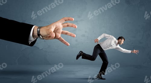 Preview: Business Man Running Away From A Huge Hand Concept On Background