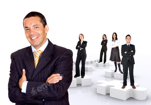 Preview: Businessman With His Teamwork On Puzzle Pieces Isolated Over A White Background