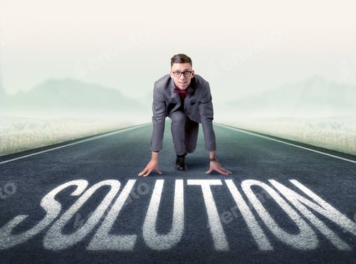 Preview: Young Determined Businessman Kneeling Before Solution Text