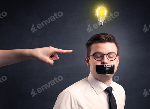 Preview: Caucasian Hand Pointing At Businessman With A Lightbulb Above His Head