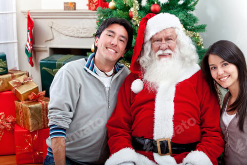 Preview: Happy Christmas Couple With Santa Claus At Home
