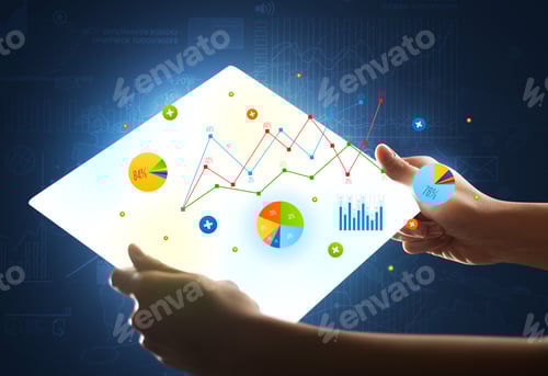 Preview: Young Female Hand Holding A Tablet With Colorful Charts