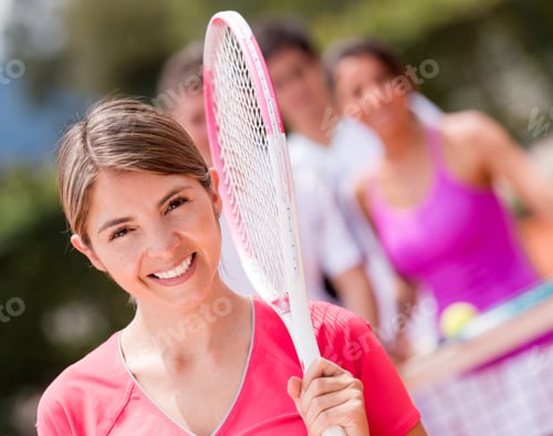 Preview: Happy Woman At The Tennis Court Smiling With A Racket
