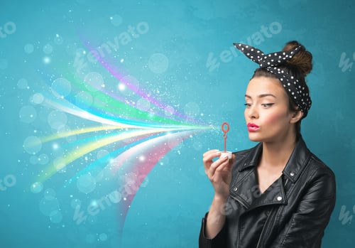 Preview: Beautiful Girl Blowing Abstract Colorful Bubbles And Lines On Blue Background