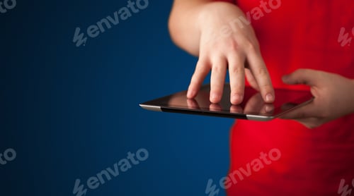 Preview: Close Up Of Hand Holding Digital Touchpad Tablet Device On Background