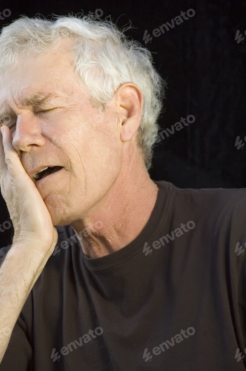 Preview: Mature White Man With Gray Hair, Eyes Closed, Head In Right Hand, Mouth Open, With Expression Of