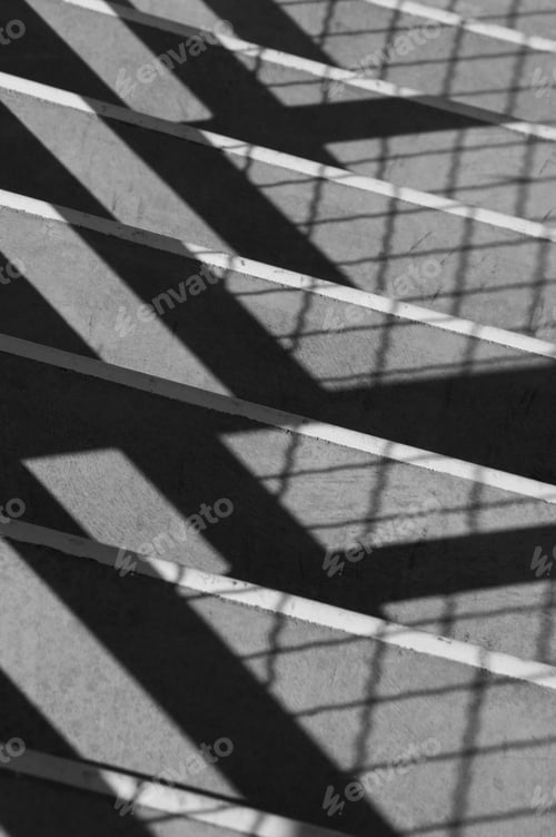 Preview: Symmetrical Shadows Cast By Sunlight On Indoor College Stairway
