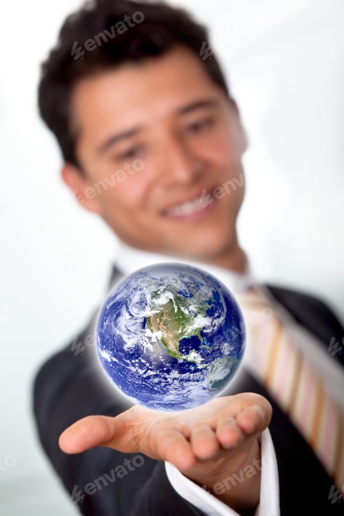 Preview: Business Man With The World In His Hands Isolated Over A White Background