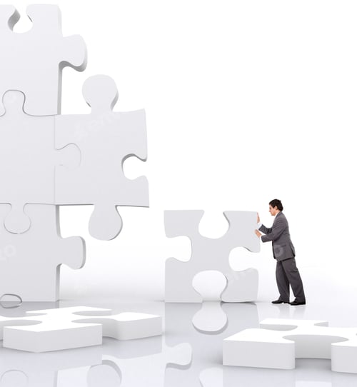 Preview: Business Man Implementing A Piece Of A Puzzle