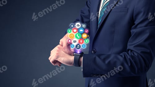 Preview: Businessman Wearing Smartwatch With Colored Application Symbols On It.
