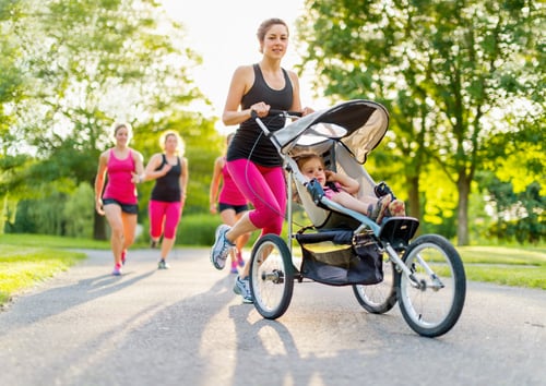 Preview: Active Woman Jogging with Stroller in a Park