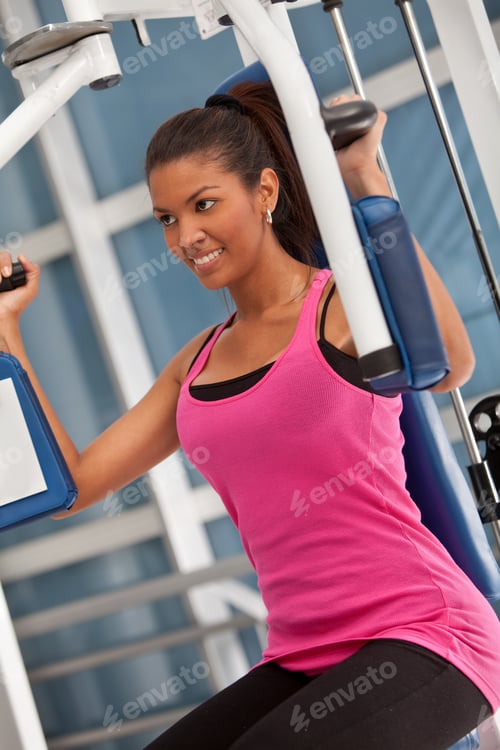Preview: Woman At The Gym Exercising On A Machine