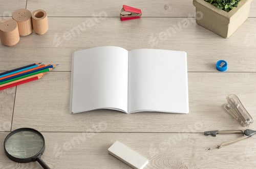 Preview: Empty Notebook On Wood Floor With Office Tools Nearby