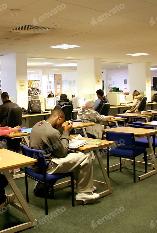 Preview: Students Studying At A Library