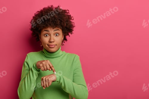 Preview: Time To Go, Hurry Up! Shocked Ethnic Woman Points At Wrist, Makes Time Gesture, Shows We Should Do