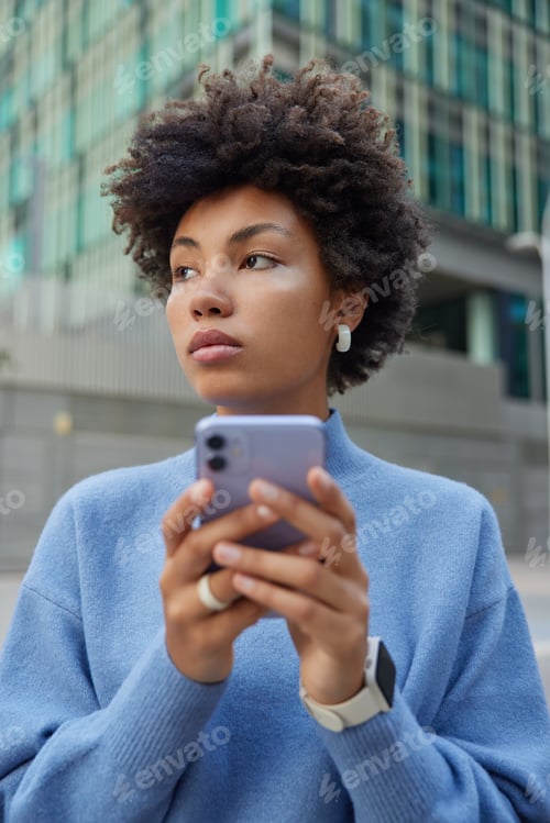 Preview: Pensive Dark Skinned Woman Blogger Uses Media Application On Smartphone Gadget Enjoys Journey Trip
