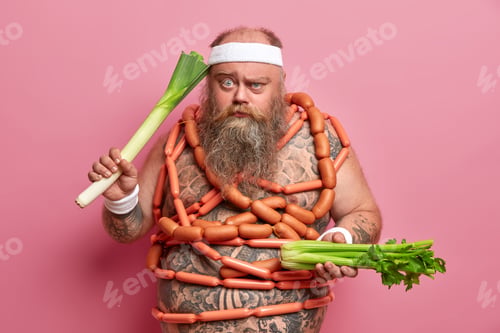 Preview: Serious Chubby Man Wears Headband, Wristbands, Holds Leek And Celery, Tries To Have Proper Healthy