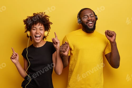Preview: Overjoyed Black Woman And Man Gesture From Happy Emotions, Have Fun Together, Listen Songs