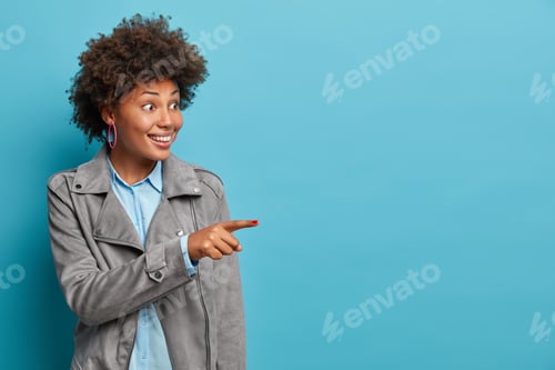 Preview: Happy Young Female Helps To Pick Best Choice, Recommends Product, Wears Stylish Clothes, Has
