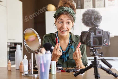 Preview: Stylish Successful Vlogger Sitting At Dressing Room With Cosmetic Products, Mirror And Professional