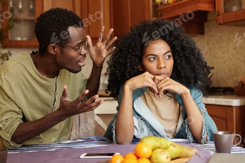 Preview: People And Relationships Concept. African American Couple Arguing In Kitchen: Man In Glasses