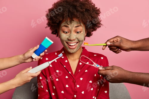 Preview: Photo Of Dark Skinned Woman Gets Dental Treatment, Cares About Teeth, Wears Red Pajama, Applies