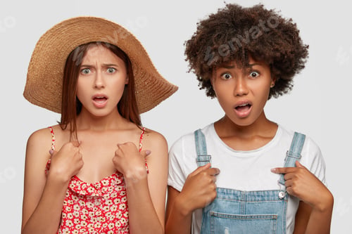 Preview: Photo Of Indignant Discontent Multiethnic Women Point At Themselves, Frown Faces In Displeasure