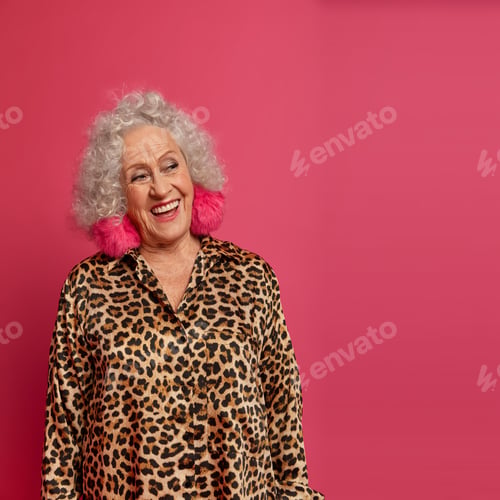 Preview: Pensive Happy Elderly Woman Glad To Be On Pension, Looks Positively Aside, Has Curly Hair, Make Up
