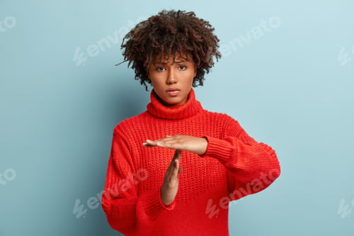 Preview: Studio Shot Of Sad Dissatisfied Tired Frustrated Woman Shows Timeout Gesture, Needs Stop, Asks Time