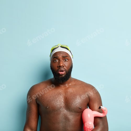 Preview: Vertical Shot Of Embarrassed Dark Skinned Man With Wet Naked Body, Surprised By Sea Storm, Comes On