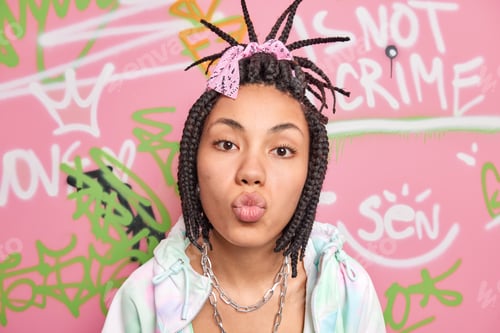 Preview: Cute Lovely Teenage Girl Keeps Lips Folded Wants To Kiss You Has Combed Dreadlocks Dressed In
