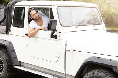 Preview: People, Lifestyle And Travel. Stylish Young Man Driving His White Four-Wheel Drive Vehicle