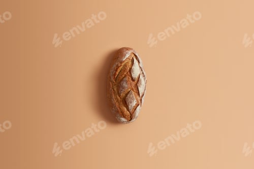 Preview: Fresh Homemade Wheat Bread Made Of Whole Rye Isolated On Beige Background. Whole Loaf For Your